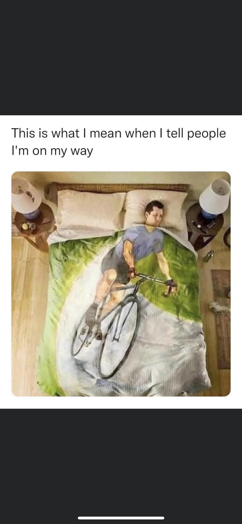 The meme is a humorous image of a person lying in bed, with a caption that reads "This is what I mean when I say I'm running late." The image shows a person fast asleep, surrounded by a messy room, with a clock on the nightstand displaying a time that's far beyond the expected arrival time. The caption implies that the person is still asleep, despite being late, and is only now waking up to realize the time.